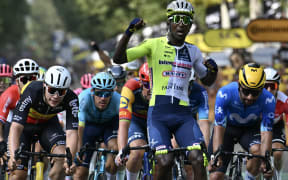 Intermarche - Wanty team's Eritrean rider Biniam Girmay cycles to the finish line ahead of second-placed Movistar Team's Colombian rider Fernando Gaviria (R) and third-placed Lotto Dstny team's Belgian rider Arnaud De Lie (L) to win the 3rd stage of the 111th edition of the Tour de France cycling race, 230,5 km between Piacenza and Turin, in Italy, on July 1, 2024. (