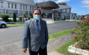 Reverend Victor Pouesi outside his EFKS church in Māngere East.