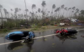Motorcycles lie on a street in Puri district after Cyclone Fani hit the coastal eastern state of Odisha, India, Friday, May 3, 2019.