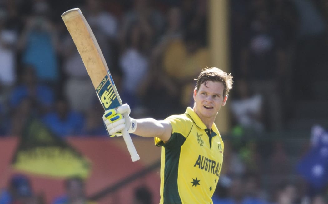 Steven Smith raises his bat after scoring a century against India at the SCG
