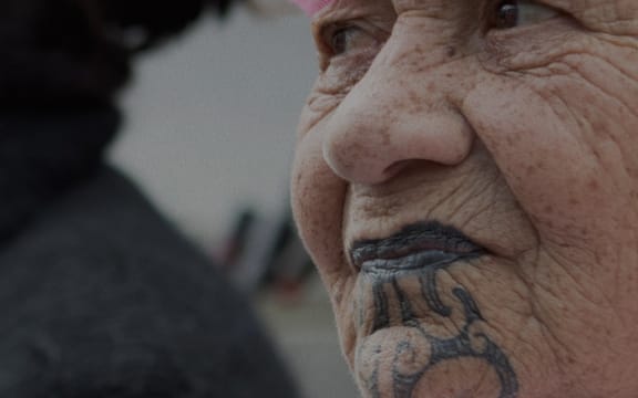 Woman at a breast cancer treatment protest march in Wellington.