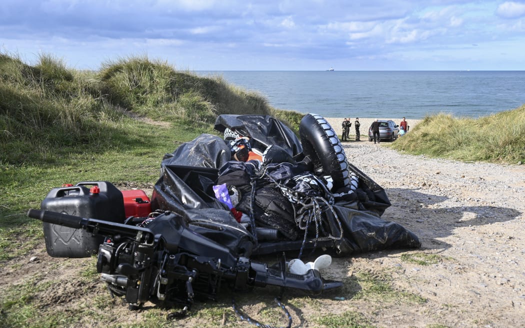 This photograph taken on September 15, 2024 shows the damaged migrants' boat after a failed attempt to cross the English Channel that led to the death of 8 people near the beach of Ambleteuse, northern France. Eight migrants died when their clandestine boat sank off Ambleteuse (Pas-de-Calais) on September 15, 2024, bringing to over 45 the number of would-be exiles to Britain who died in the Channel in 2024. (Photo by Bernard BARRON / AFP)