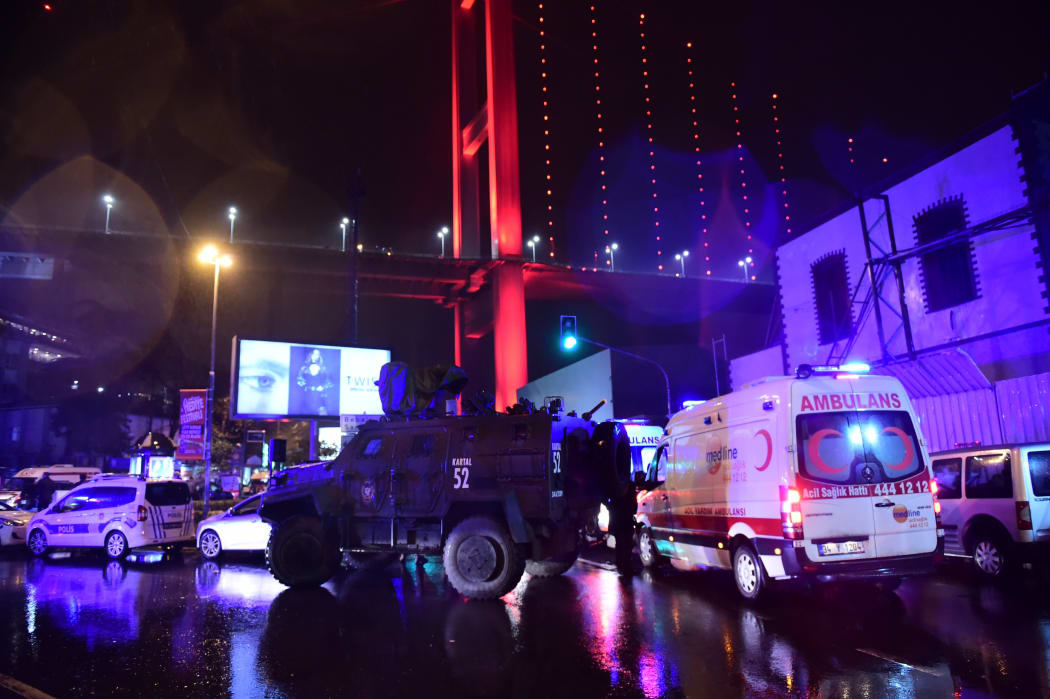 Turkish special force police officers and ambulances are seen at the site of an armed attack on 1 January, 2017 in Istanbul.