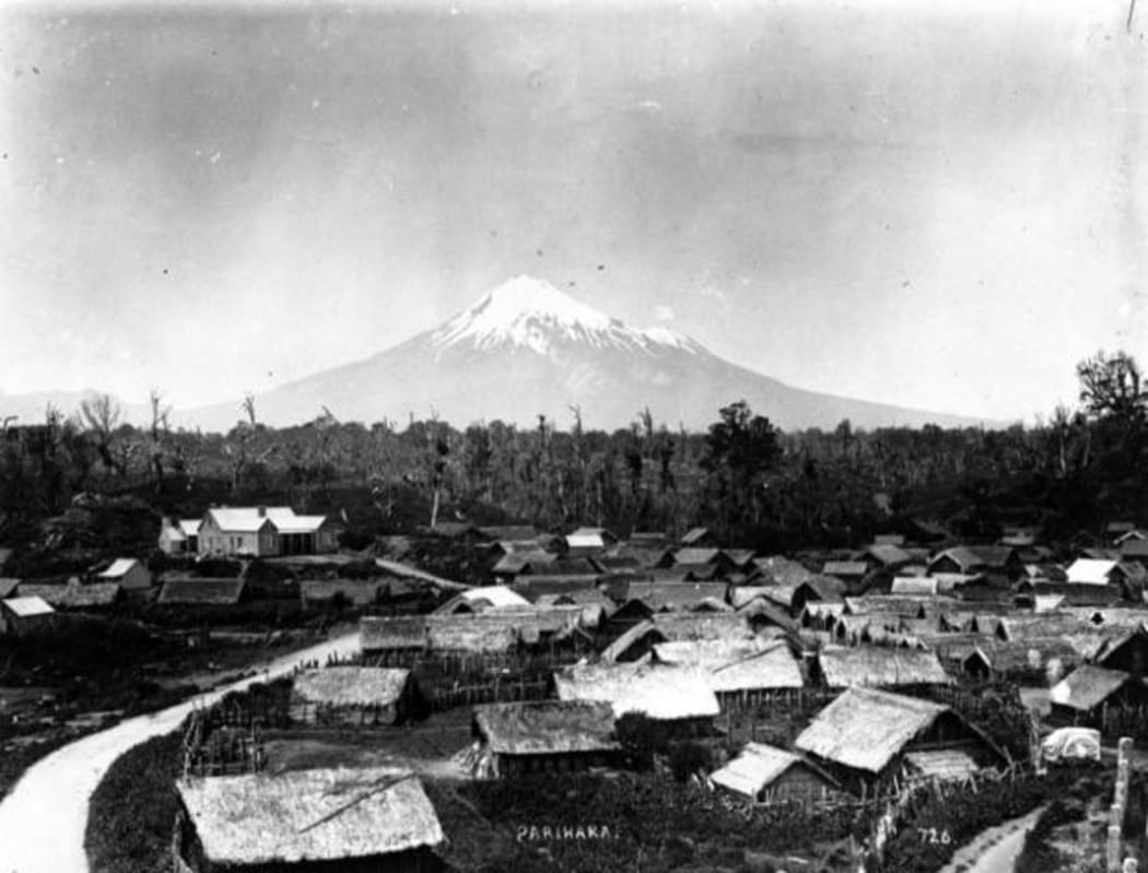 Parihaka Pa, circa 1900, with Mount Taranaki - taken by an unidentified photographer.
