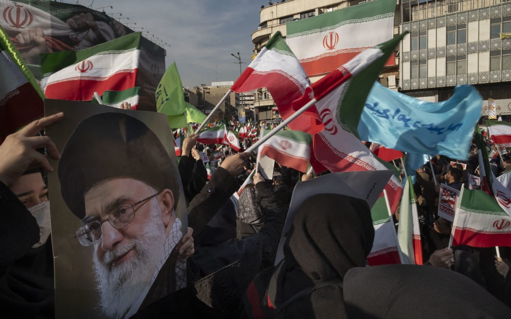 Iranian protesters participate in a pro-Government rally in Tehran, Iran, on January 12, 2026. The rally takes place in Tehran against the recent anti-government unrest, opposition to the U.S. and Israel in Iran, and in support of Supreme Leader Ayatollah Ali Khamenei. (Photo by Morteza Nikoubazl/NurPhoto) (Photo by Morteza Nikoubazl / NurPhoto via AFP)