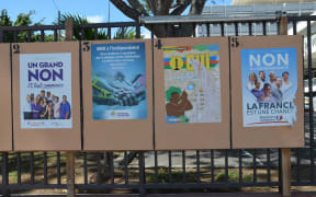 Posters related to the referendum adorn the streets of Noumea