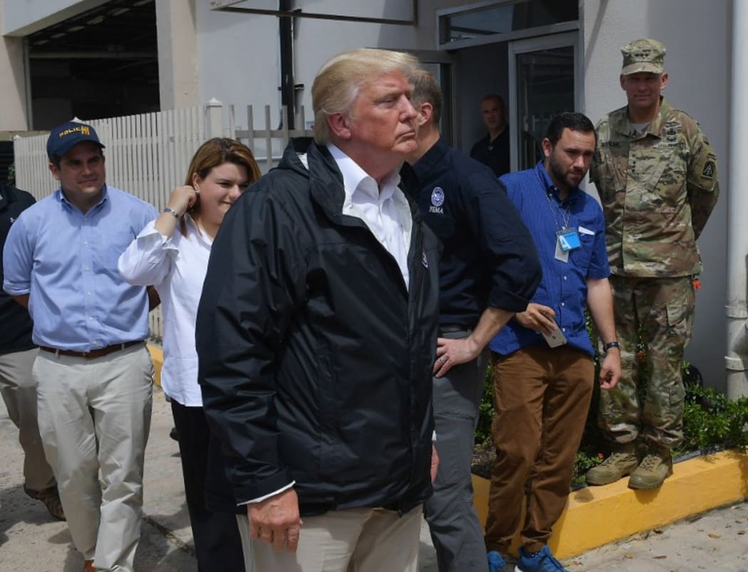 US President Donald Trump visits residents west of San Juan, Puerto Rico, nearly two weeks after Hurricane Maria hit territory.