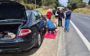 This car was damaged by potholes opening on State Highway 5.