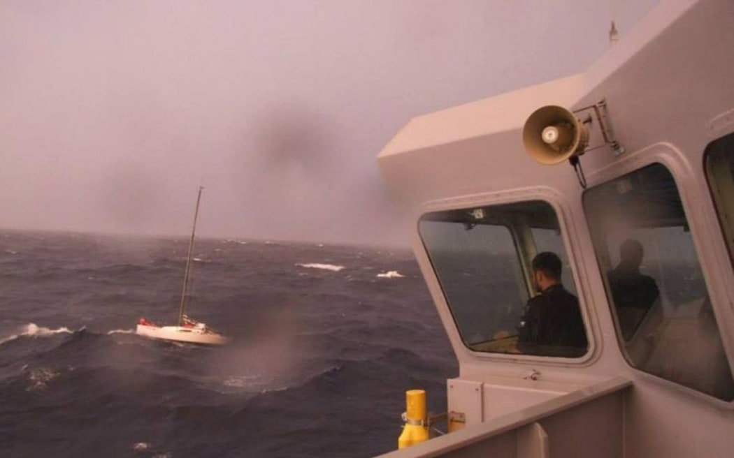 The view of yacht Django from HMNZS Otago's bridge as the ship considers the best way to effect a rescue.