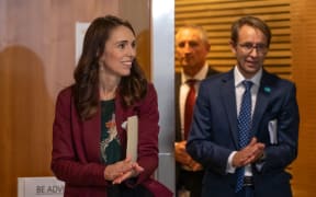 Prime Minister Jacinda Ardern sanitises her hands with Director-General of Health Dr Ashley Bloomfield while walking to a Covid-19 coronavirus briefing on 6 May, 2020.