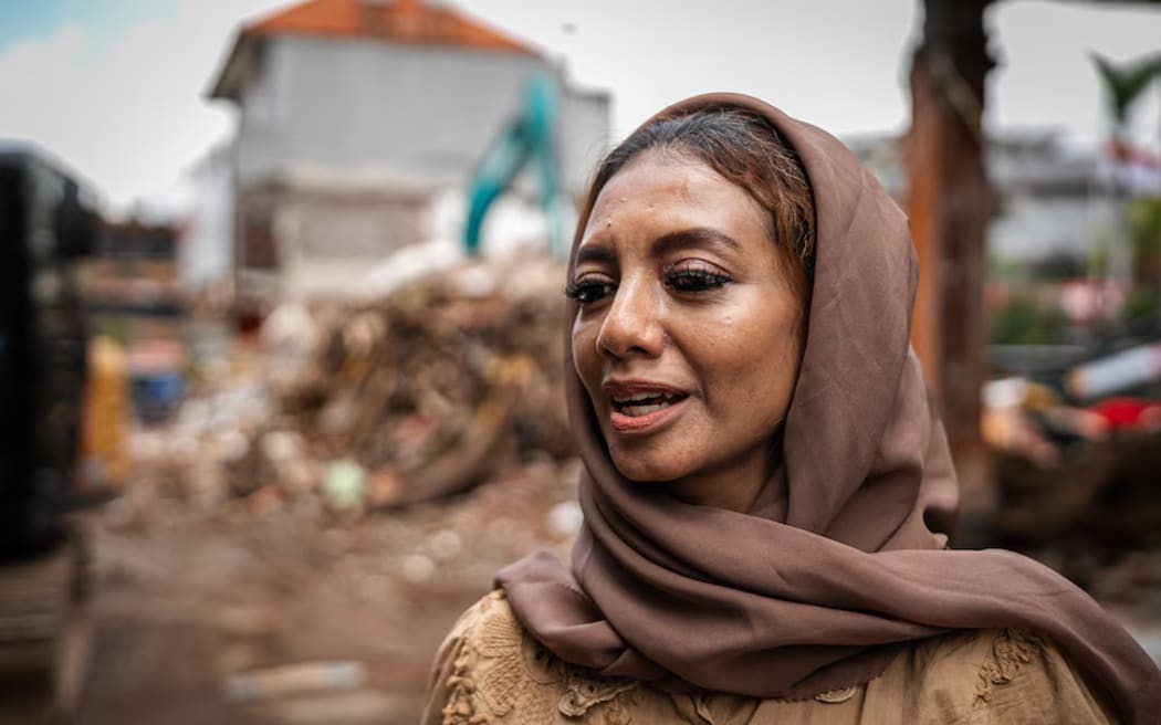 Rukayah's family lost their batik store in the flood.