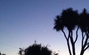 Tricia Lewis took this picture of the balloon light up as the sun set.