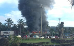 An angry mob torches the courthouse on Rapanui.