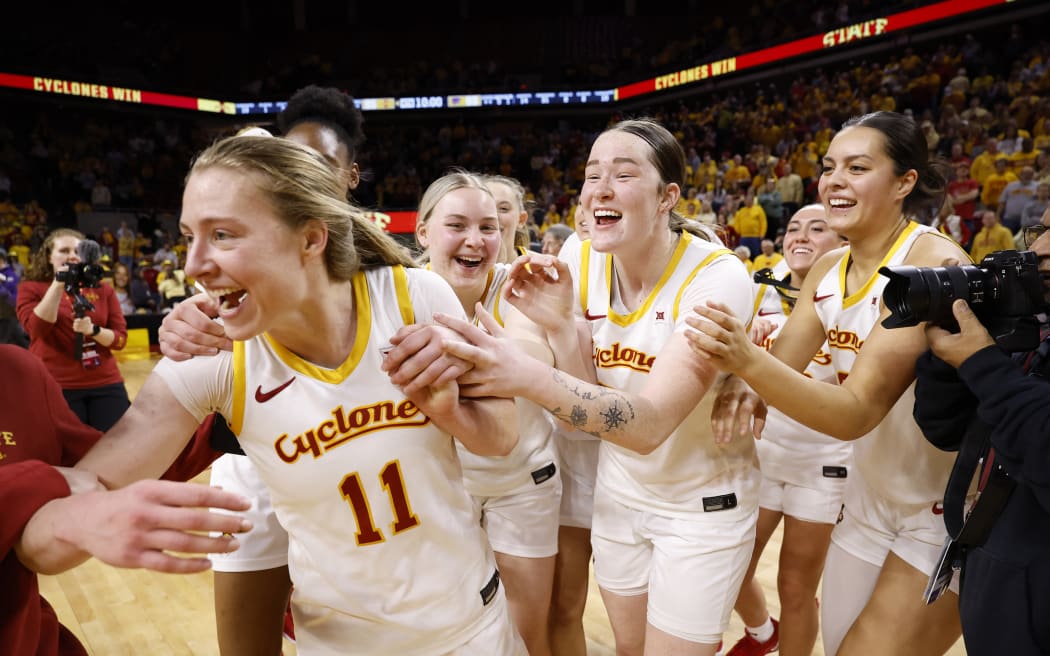 Emily Ryan #11 of the Iowa State Cyclones celebrates with teammates Aili Tanke #32, Addy Brown #24, and Lilly Taulelei #9 of the Iowa State Cyclones