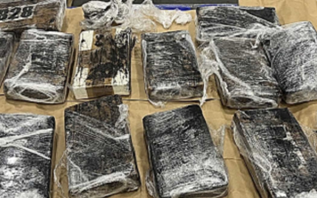 More than 75 packages of cocaine wrapped in cellophane were located in bags.