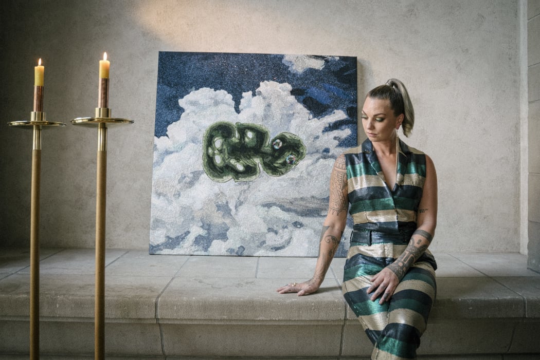 Hollie with the artwork by Reuben Paterson
