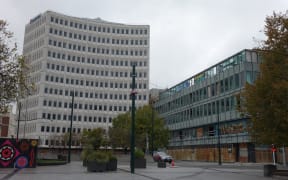 The Millennium Hotel (left) and the half-demolished former BNZ House are in insurance and commercial limbo.