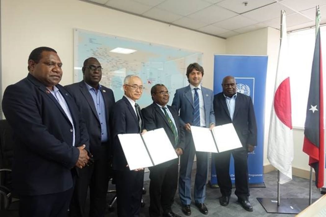The signing of the agreement between Bougainville and Japan.
