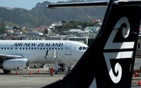 An Air New Zealand airplane wait for passengers at Wellington International airport on February 20, 2020.