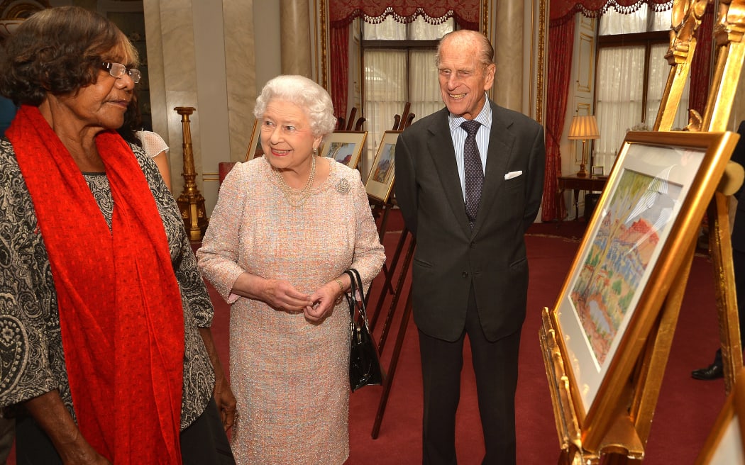 Queen Elizabeth II talks with Lenie Namatjira, the granddaughter of Albert Namajtira , during a private meeting with members of his family in 2013