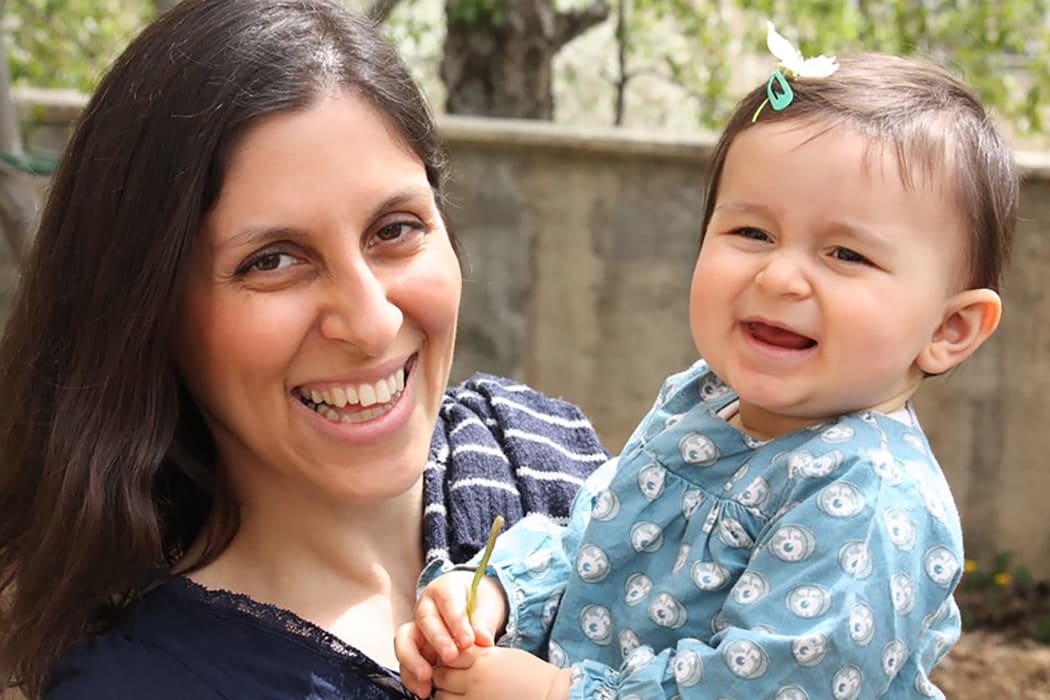 (FILES) In this file handout photo released by the Free Nazanin campaign in London on June 10, 2016 shows Nazanin Zaghari-Ratcliffe (L) posing for a photograph with her daughter Gabriella.