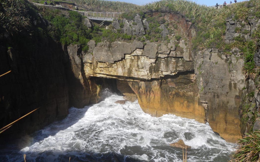 A view of the surge pool with undercut geology over which the Dolomite Point Track at Punakaiki passes.