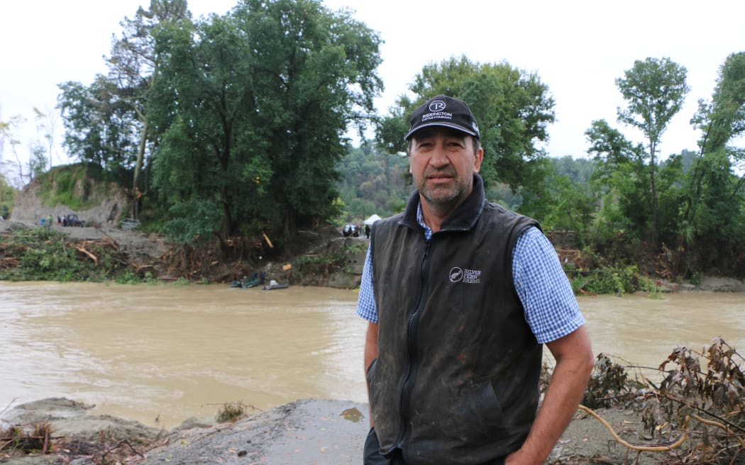 Rissington Station farmer, Jeremy Absolom, standing at the site of the now destroyed Rissington Bridge, which was taken out by Cyclone Gabrielle.