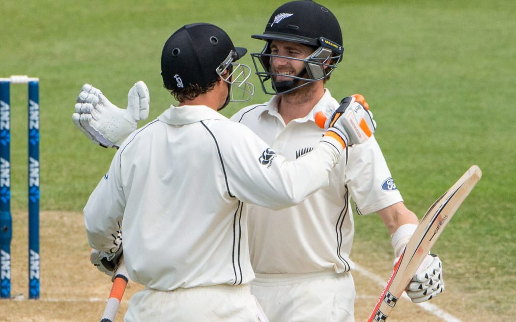 Kane Williamson celebrates his maiden test double century with teamate BJ Watling.