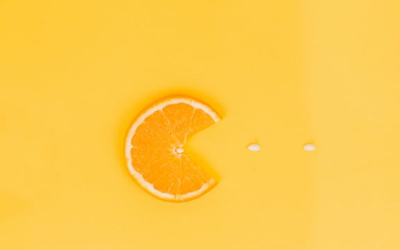 Orange slice gobbling up some vitamin C, Pac-Man style