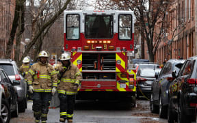 PHILADELPHIA, PA - JANUARY 05: Firefighters are pictured near the scene of the fatal fire in the Fairmount neighborhood on January 5, 2022 in Philadelphia, Pennsylvania.