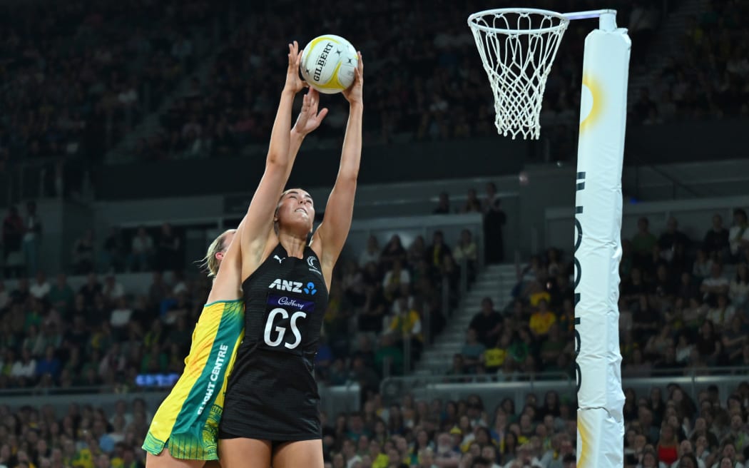Amelia Walmsley of New Zealand (right) catches the ball during the Constellation Cup match between the Australian Diamonds and the New Zealand Silver Ferns at John Cain Arena in Melbourne.