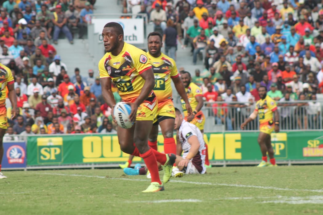 PNG Hunters halfback Watson Boas shapes to kick.