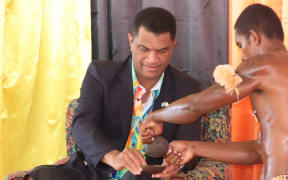 Fiji's Education Minister Aseri Radrodro receives a bowl of kava during the opening ceremony of the Special and Inclusive Education Policy launch on 7 June 2024.
