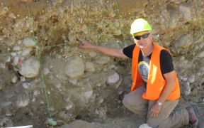 Professor Mark Stirling checking out the soil layers at their field work in West Otago.