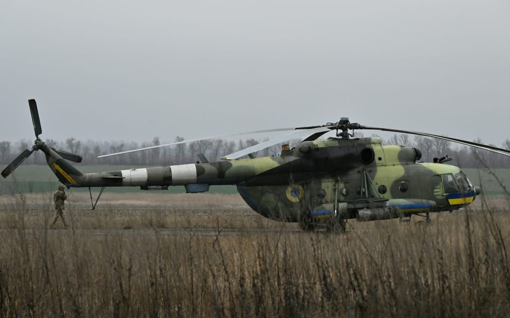 Ukrainian servicemen of an Army Aviation Brigade prepare a Mi-8 helicopter to fly in the Donetsk region on 7 December, 2023, amid the Russian invasion of Ukraine.