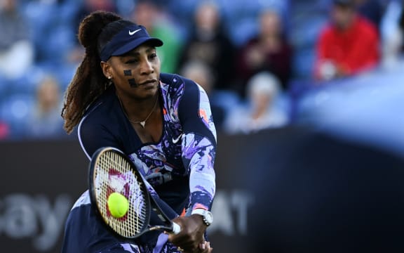 Serena Williams of the US, playing with Tunisia's Ons Jabeur, returns the ball to Japan's Shuko Aoyama and Taiwan's Chan Hao-ching during their women's doubles quarter final tennis match on day four of the Eastbourne International tennis tournament in Eastbourne, southern England on June 22, 2022. (Photo by Glyn KIRK / AFP)