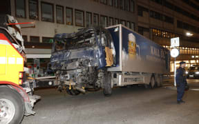 The stolen truck, which was driven through a crowd outside a department in Stockholm on April 7, 2017, is removed from the area.