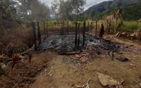 The burnt remains of a  house in Karida