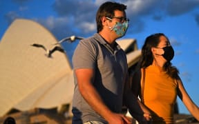 SYDNEY, AUSTRALIA - OCTOBER 18: The Sydney Opera House can be seen as a patrons attend the Opera Bar, as NSW passes the 80 per cent double vaccination milestone in Sydney, Australia, Monday, October 18, 2021.
