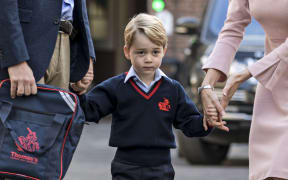 Britain's Prince George arrives for his first day of school at Thomas's lower school in southwest London.