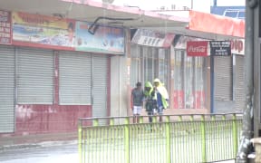 Sheltering from the rain in downtown Nadi, Fiji.