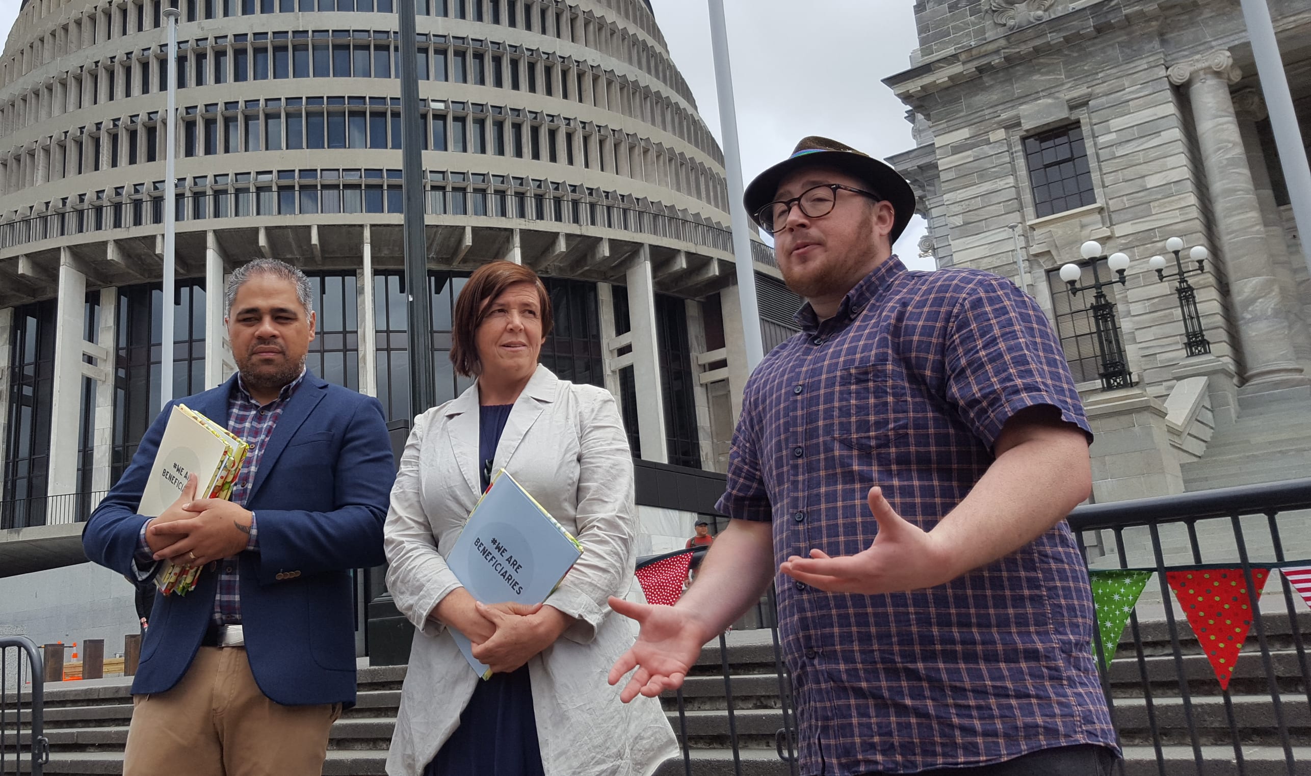Associate social development minister Peeni Henare (left, Green MP Jan Logie, and artist Sam Orchard