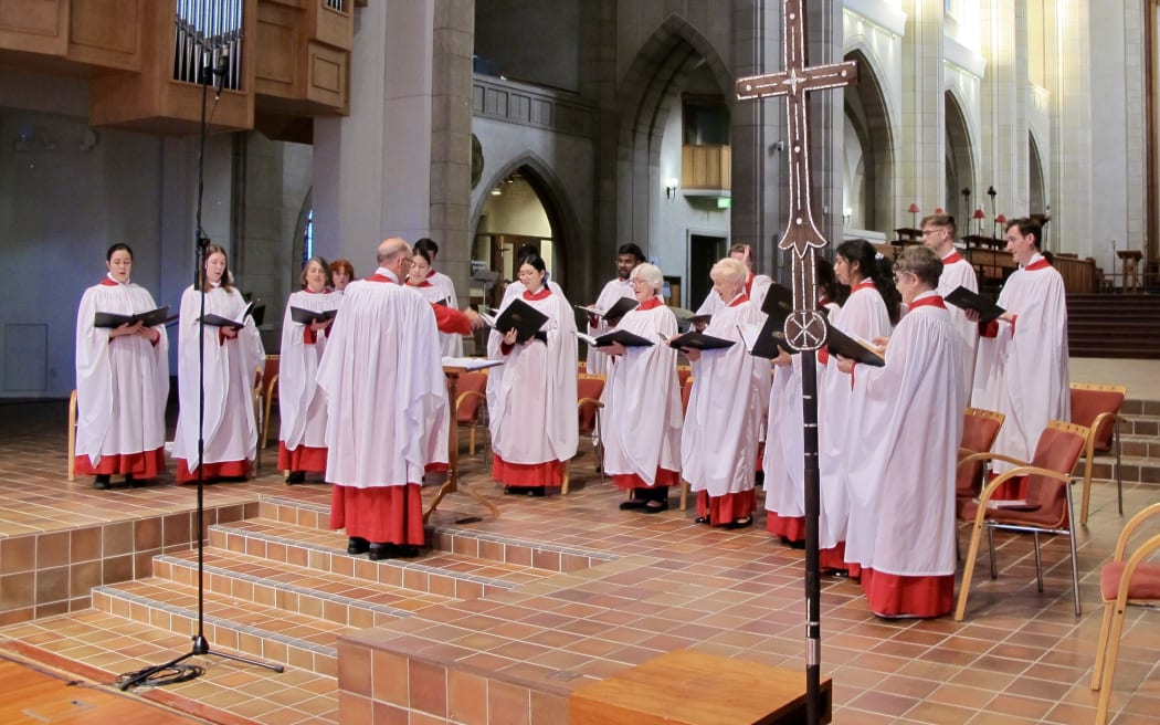 Peter  Watts conducting the choir