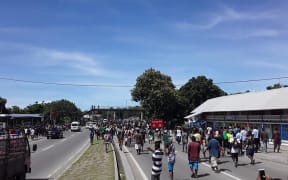 One of the angry mobs in Solomon Islands walking down the main road past Chinatown in Honiara after the election of the prime minister. 24 April 2019