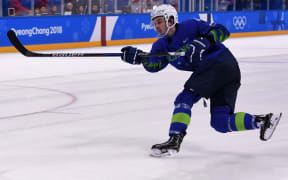Slovenia's Ziga Jeglic scores a goal at the Winter Olympics