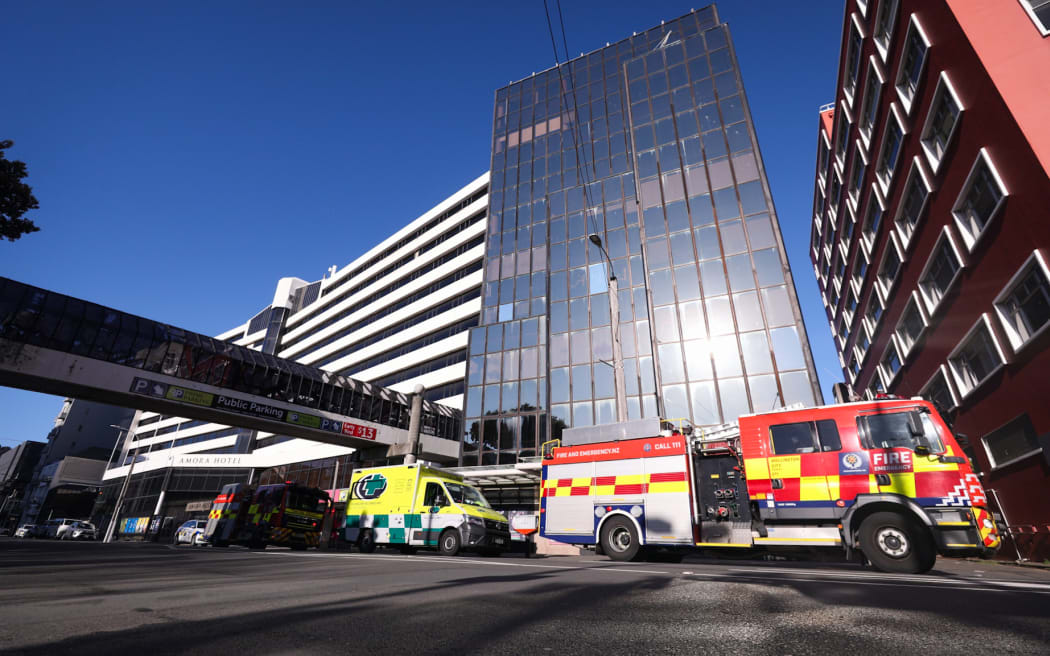 Emergency services outside a boarded up building in downtown Wellington where a person was injured falling three storeys through a collapsed stairwell.