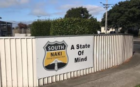 South Naki's sign on the street.
