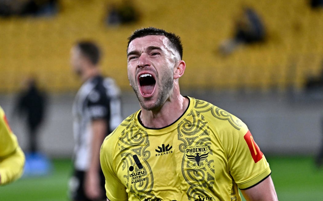 Alex Rufer, of the Wellington Phoenix leads the team out during