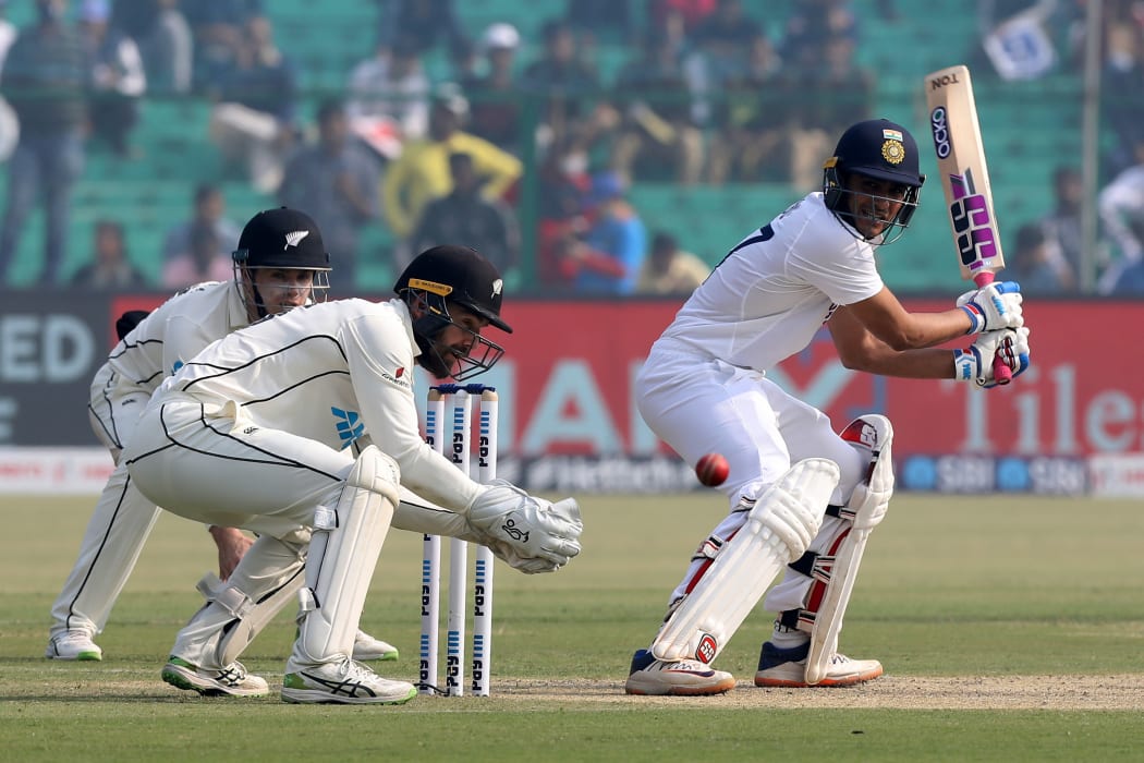 Shubman Gill of India play a shot past BlackCaps wicketkeeper Tom Blundell