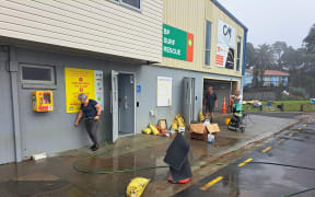 The clean-up at Waihi Beach Surf Life Saving Club after the flood.